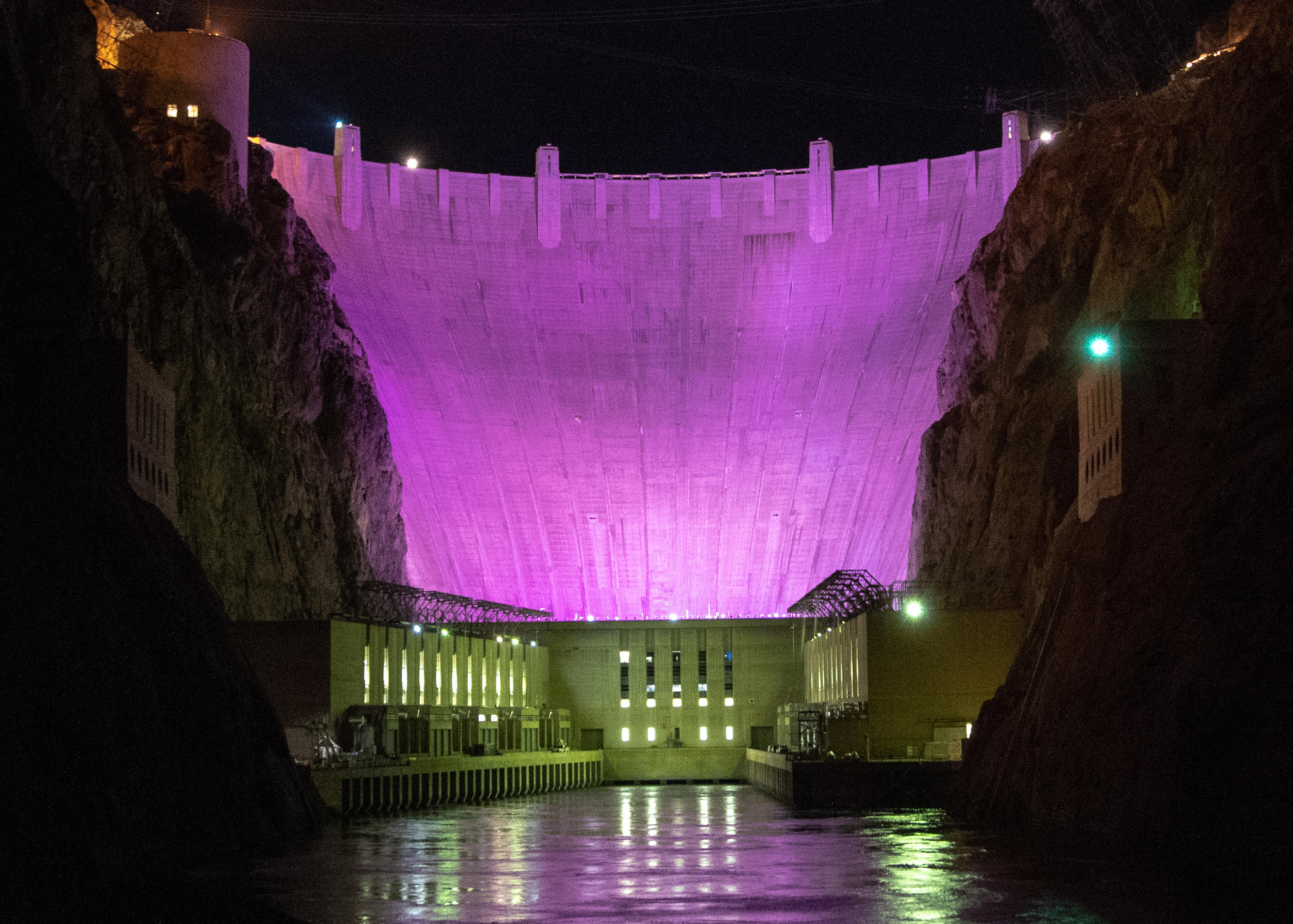 Hoover Dam was lit purple Monday night to raise awareness about the impacts of domestic violence.